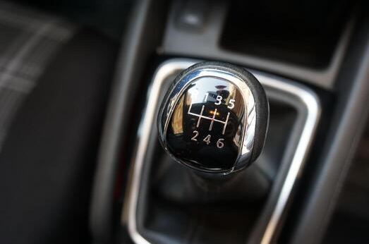 manual car gear shift showing drive mode inside driving lesson vehicle