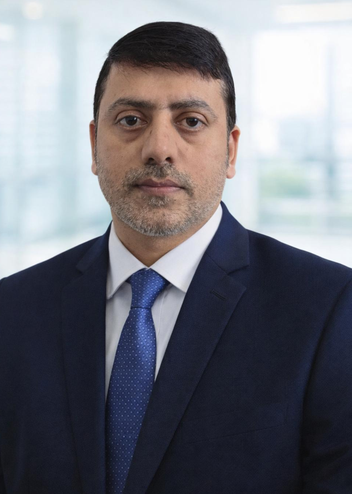 driving instructor Razi professional headshot for driving school Glasgow